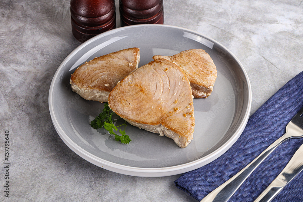 Roasted red tuna steak in the plate Roasted red tuna steak in the plate