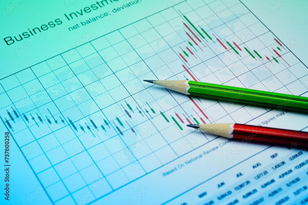 Pencil on stock market graph, Business investment concept Pencil on stock market graph, Business investment concept