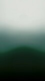 A Green and White Gradient Blur: An Abstract Background with a Rounded Shape and a Soft Texture