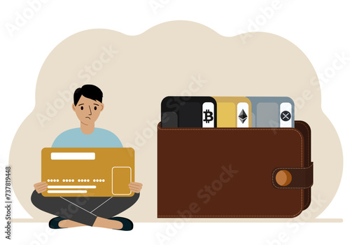 A man holds a card, next to a wallet with different cards for cryptocurrencies. Internet wallet, digital money transactions, exchange platform, cold wallet or hardware wallet.