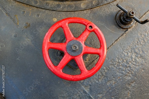 Manual operated valve on a steam ship.