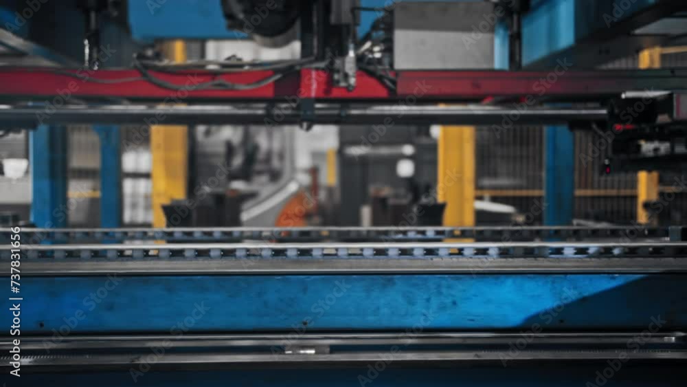 A conveyor belt in a factory along which aluminum panels move for the production of high-tech products A conveyor belt in a factory along which aluminum panels move for the production of high-tech products