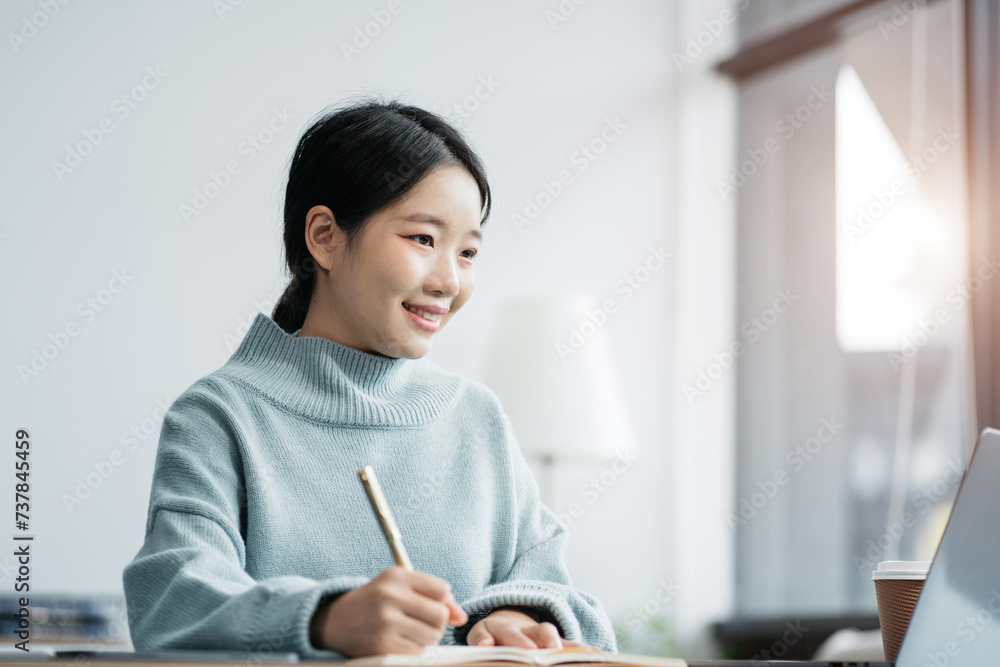 Female writes information businessman working on laptop computer writing business plan while sitting in office. Female writes information businessman working on laptop computer writing business plan while sitting in office.