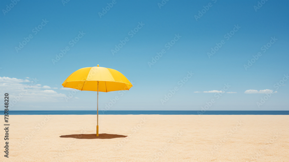A yellow umbrella sitting on top of a sandy beach.
