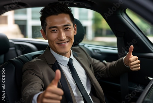 a man in a suit and tie giving a thumbs up