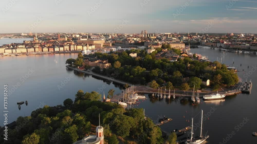 Aerial view of Stockholm at sunrise with lush islands and waterways. Slow drone orbit. Aerial view of Stockholm at sunrise with lush islands and waterways. Slow drone orbit.