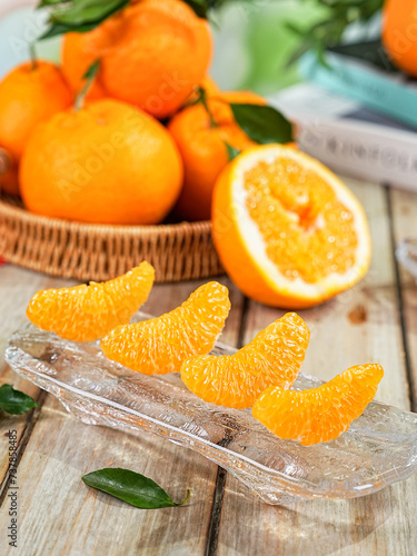 Chinese orange variety (Citrus reticulata 'Chun Jian' or papagan), close-up on tabletop indoors photo