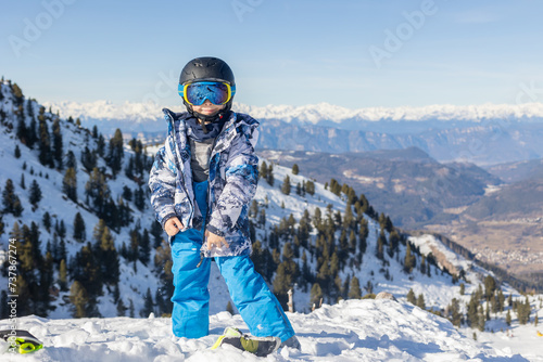 Children and adults, happy family in winter clothing at ski vacation, skiing, winter