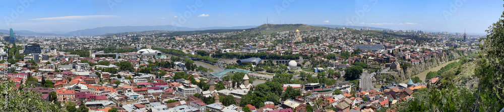 Beautiful landscape panorama of city Tbilisi with the background of blue sky