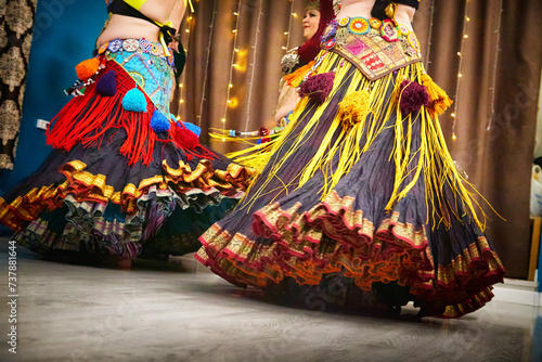 Group of Women dancing tribal and Wearing Colorful Tassels