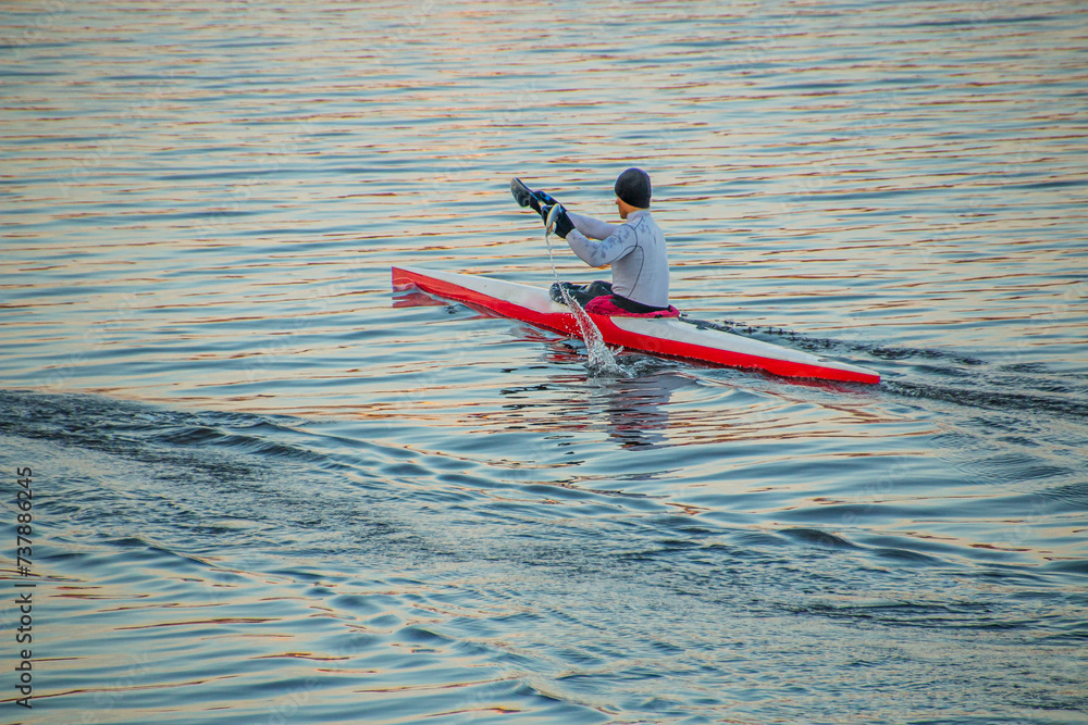 Guy rowing an oar in a kayak