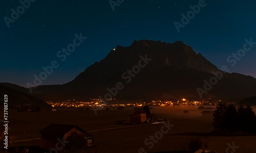 Foggy alpine long exposure night view with Mount Zugspitze at Lermoos, Reutte, Tyrol, Austria