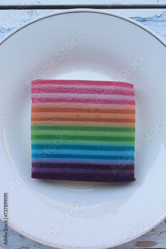 Traditional Indonesian food called lapis warna warni in a white plate on the table