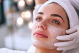 Beautician doing facial skin care for Caucasian girl in beauty salon