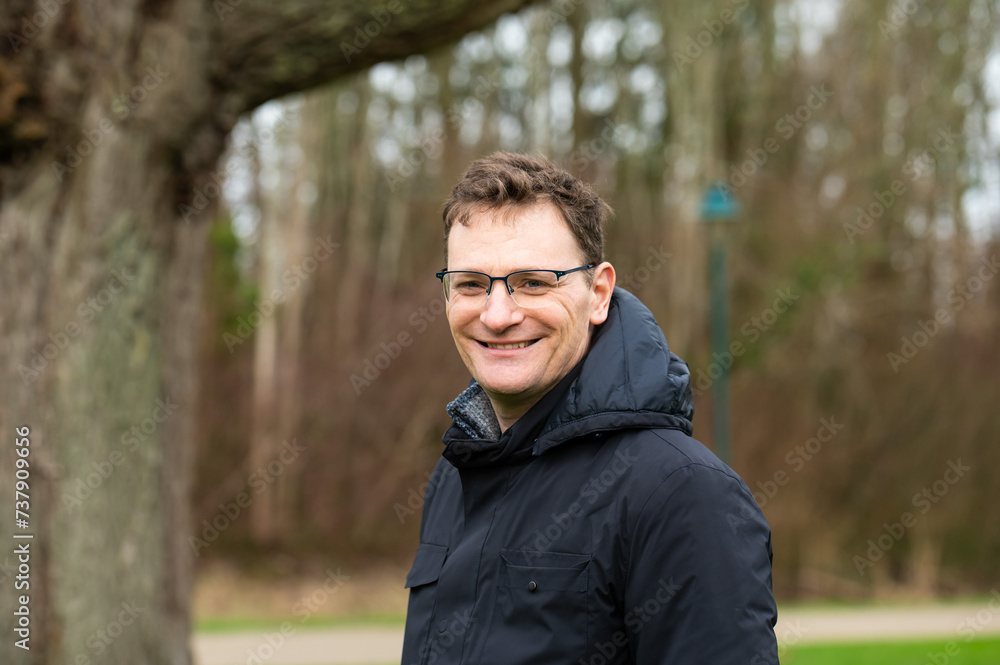 Portrait of a 44 yo white man with a natural winter landscape in the background, Belgium Portrait of a 44 yo white man with a natural winter landscape in the background, Belgium