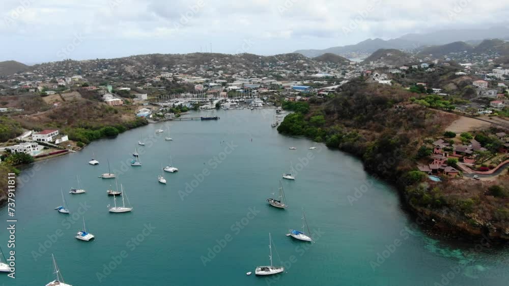 Sailboats in prickly bay marina, grenada, with tropical coastline, aerial view Sailboats in prickly bay marina, grenada, with tropical coastline, aerial view