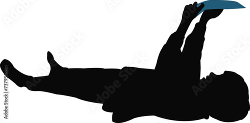 a boy lying down and reading, silhouette vector