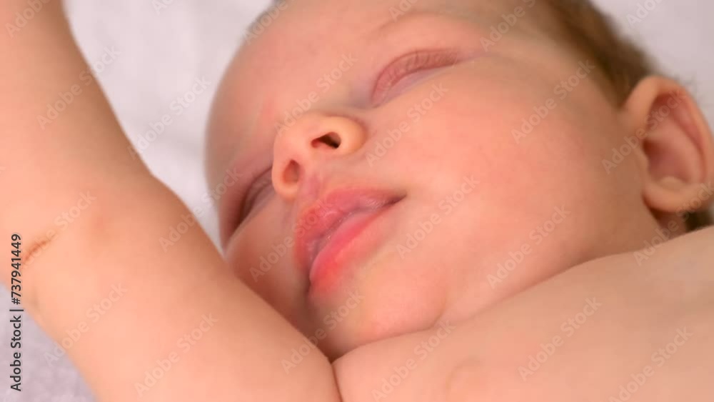 baby is sleeping on the bed. selective focus. baby is sleeping on the bed. selective focus.