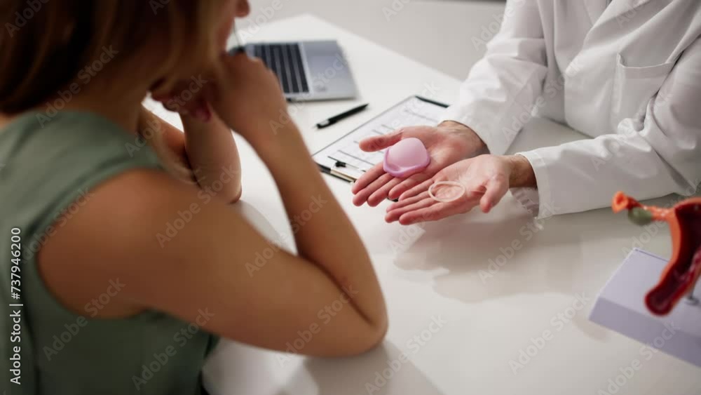 Gynecologist Showing Contraception Ring And Diaphragm Gynecologist Showing Contraception Ring And Diaphragm