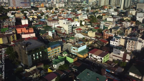 Drone shot over vibrant dwellings, golden hour in Makati city, Manila, Philippines photo