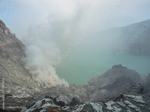 The lake full of natural Sulfuric acid and hydrogen sulfide gas inside the volcano carter at Kawah Ijen, East Java, Indonesia.