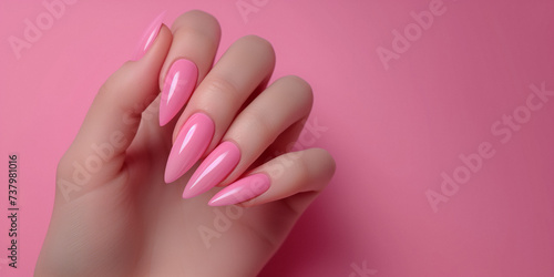 Female hand with pink nail design  Nail Polish. Art Manicure. Modern style pink Nail Design.