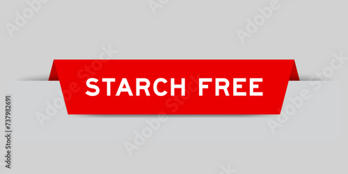 Red color inserted label with word starch free on gray background photo