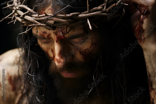 Closeup image of Jesus Christ wearing crown of thorns, injured, suffering and exhausted, religious scene, Good Friday and Easter concept.