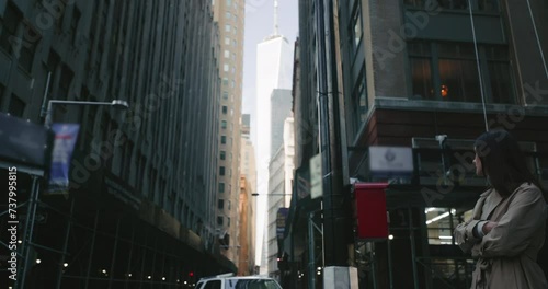 Cinematic shot of brunette female in moody concrete jungle of New York City