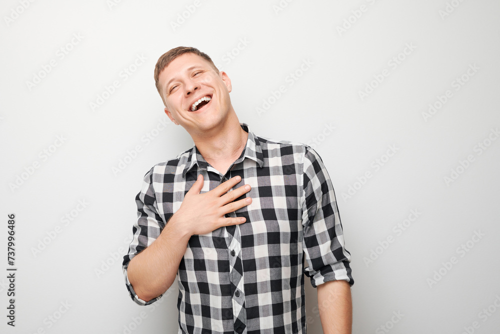 Portrait man smiling and laughs joyfully with happy face isolated on white studio background, advertising banner. Portrait man smiling and laughs joyfully with happy face isolated on white studio background, advertising banner.