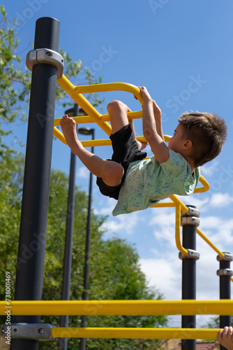 Boy climbing in a park