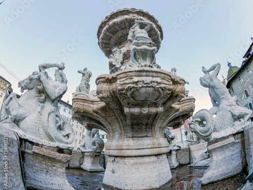 Neptune fountain in Dome place in front of the Medieval Cathedral of San Vigilio in Trento , Italy