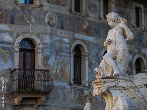 Neptune fountain in Dome place in front of the Medieval Cathedral of San Vigilio in Trento , Italy