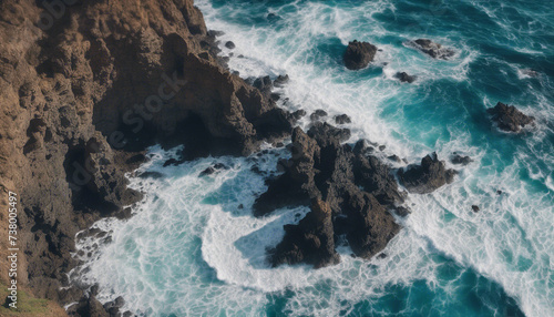 Drone view of Tenerife south coast with Atlantic ocean and strong swell beating against the walls of