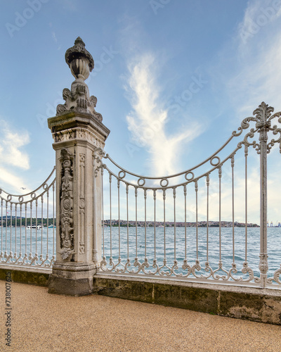 Ornate wrought iron fence decorated with intricate designs at the Dolmabahce Palace overlooking the Bosphorus Strait in Istanbul, Turkey