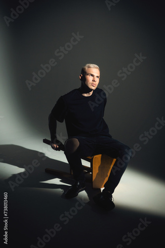 Portrait of a young man with rock musician makeup using a gobo mask.
