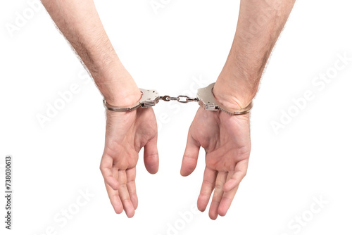 Arrested man handcuffed hands. Prisoner or arrested man, close-up of hands in handcuffs, selective focus.