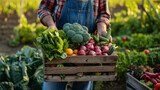 Midsection of farmer holding wooden crate with fresh vegetables on farm field