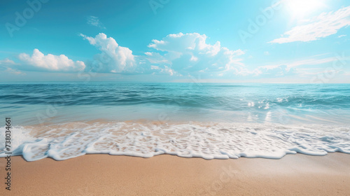 empty sandy ocean beach, sunshine, glare on the water, clear sea