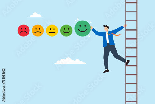 Young man on the ladder giving feedback rating with smile emoticons