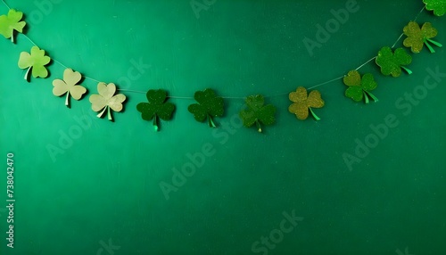 Happy St. Patricks day background with Green glitter shamrocks garland hanging with clippers created with generative ai 