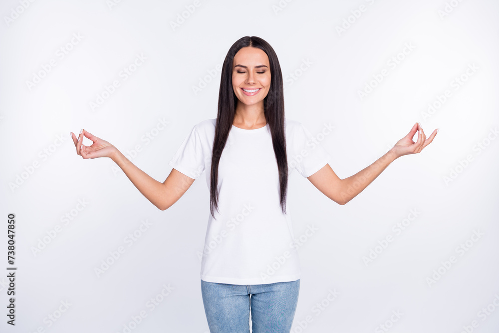 Photo portrait of woman smiling peaceful meditating practising yoga isolated on white color background Photo portrait of woman smiling peaceful meditating practising yoga isolated on white color background