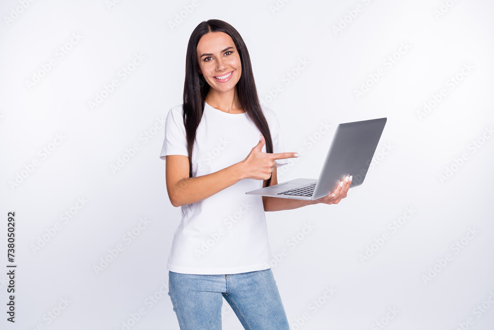 Photo portrait of woman showing recommending using laptop isolated on white color background Photo portrait of woman showing recommending using laptop isolated on white color background
