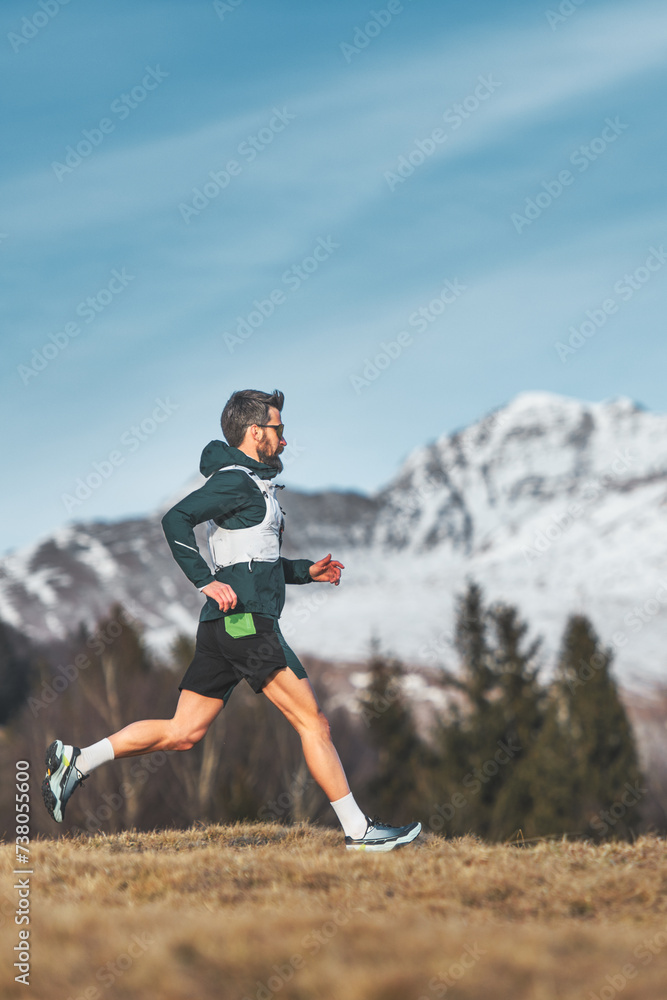 Man ultramarathon runner in the mountains Man ultramarathon runner in the mountains