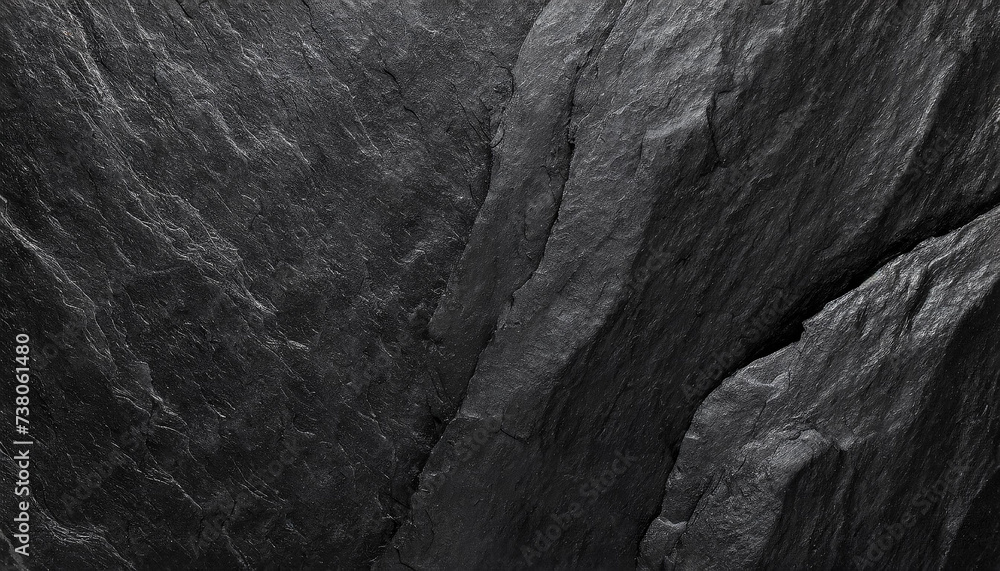 A close-up of dark, rugged rock textures, highlighting the intricate patterns and deep shadows, Ideal for backgrounds, nature themes, or abstract art. A close-up of dark, rugged rock textures, highlighting the intricate patterns and deep shadows, Ideal for backgrounds, nature themes, or abstract art.