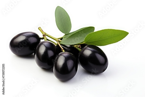 Ripe black olives with olive leaves on a white background. Organic food.