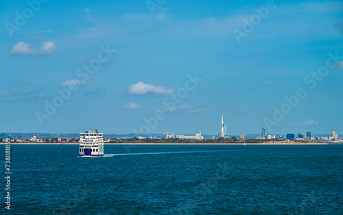 A view with a sea ferry heading to the Portsmouth harbour in summer