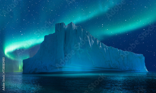 Iceberg floating in greenland fjord  
with aurora borealis - Greenland photo