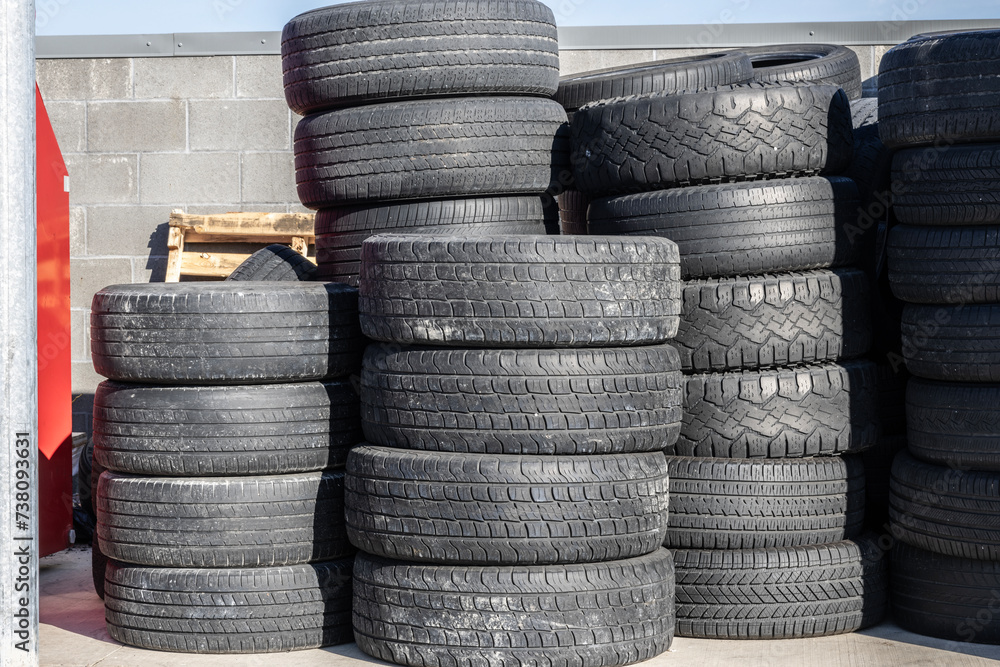 Old, discarded tires, tyres, waiting for the scrap heap or to be recycled. Old, discarded tires, tyres, waiting for the scrap heap or to be recycled.