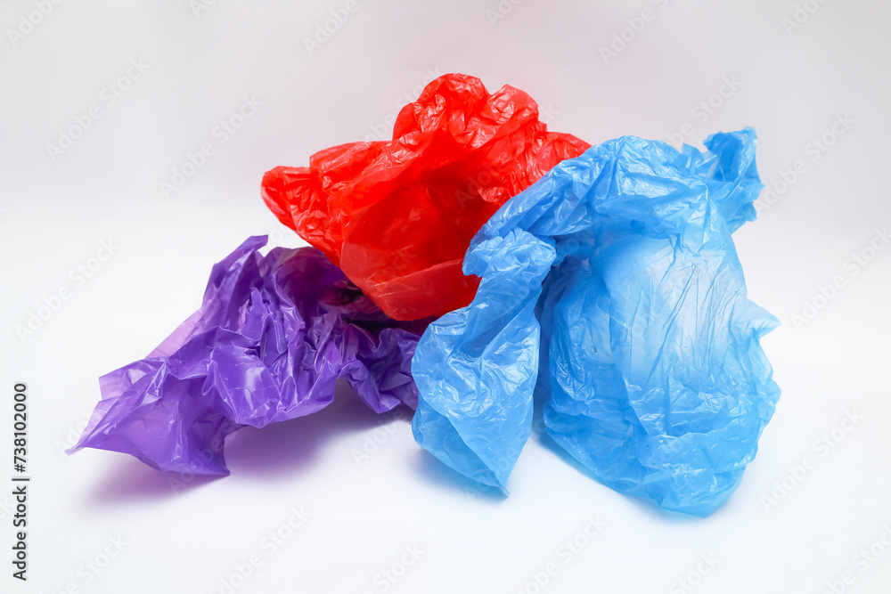 Three crumpled plastic bags